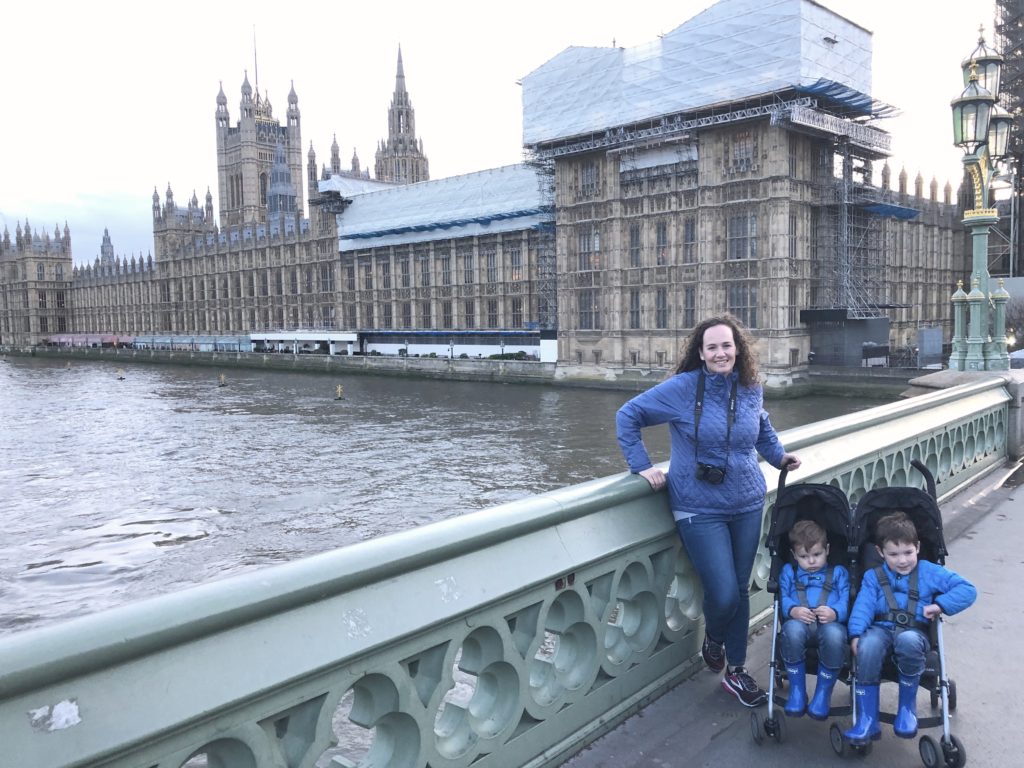 Our Rental Stroller in front of the British Parliament building - Exploring Through Life