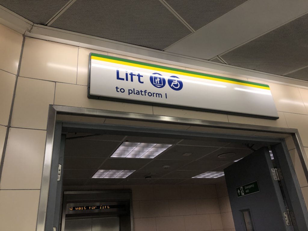 Lift signage in the London Undergound - Renting a Stroller in London - Exploring Through Life