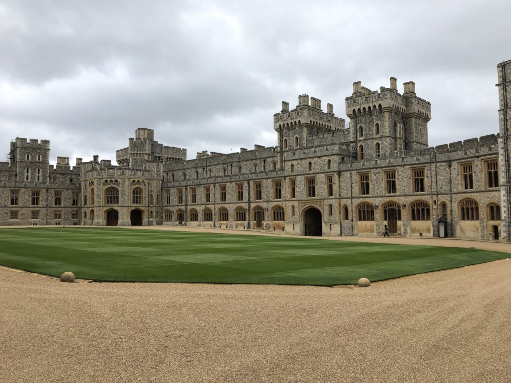 The courtyard at Windsor Castle - Exploring Through Life - Visit the gorgeous Windsor Castle for a quiet escape from the city of London. Tour the chapel where Prince Harry and Meghan Markle were read and experience a surprisingly kid-friendly excursion at the Queen's weekend residence. Windsor is the perfect day trip from London.