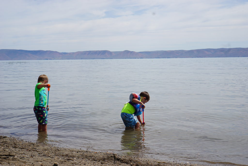 Bear Lake is the perfect wading lake for little kids with its shallow waters - Things to do in Bear Lake for Families - Exploring Through Life