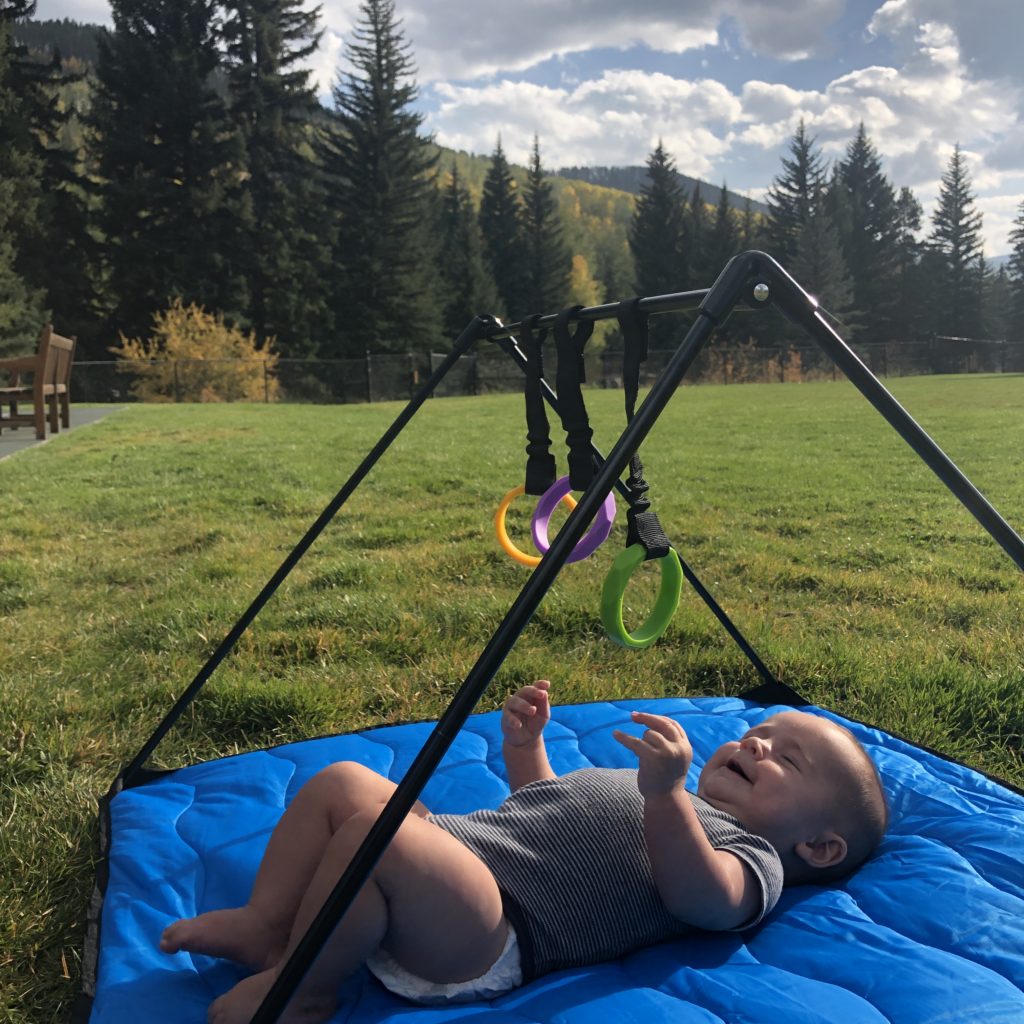 The Lay and Play Adventure Mat is a great way to let your baby stretch out and wiggle while taking a break from hiking. - Tips for Hiking with a Baby - Exploring Through Life