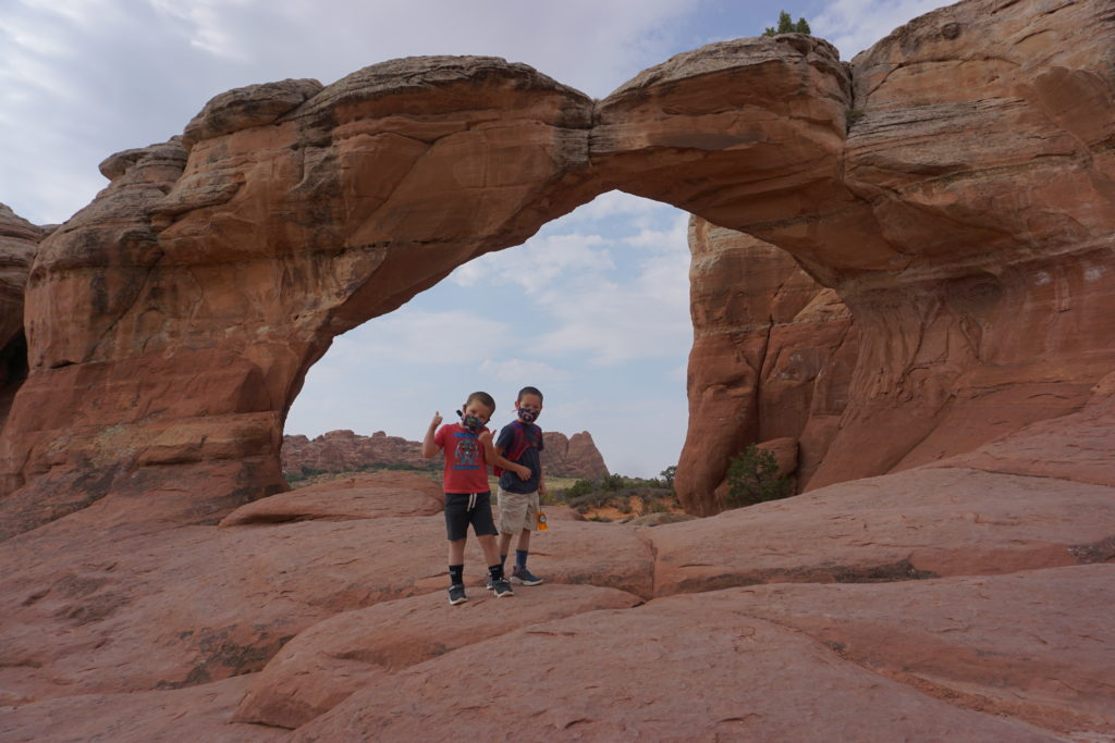 The hike to Broken Arch in Arches National Park is kid-friendly and flat. - Exploring Through Life